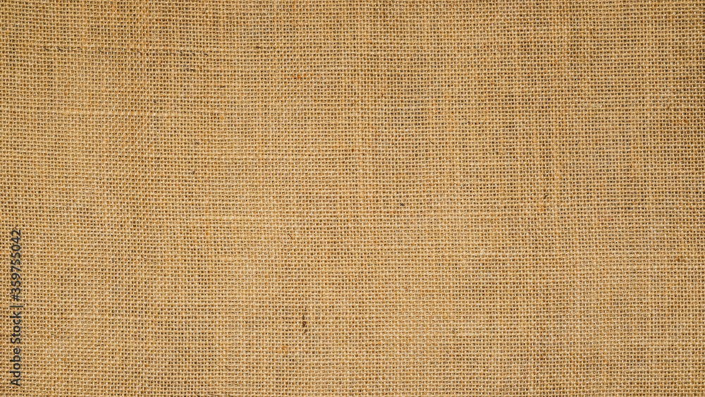 Cotton woven fabric background with flecks of varying colors of beige and brown. with copy space. office desk concept / Hessian sackcloth burlap woven texture background High Resolution horizontal . Cotton woven fabric background with flecks of varying colors of beige and brown. with copy space. office desk concept / Hessian sackcloth burlap woven texture background High Resolution horizontal .