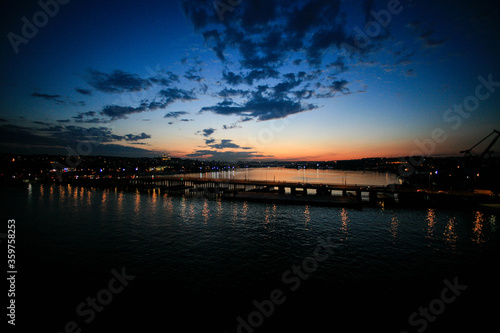 bridge view. bridge lights reflections in the sea. sunset © Yasar