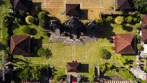 Top view aerial photo from flying drone of a traditional Bali temple with beautiful old architecture. Place for Buddhist worship in Thailand. Retro buildings for Hinduism religious photo