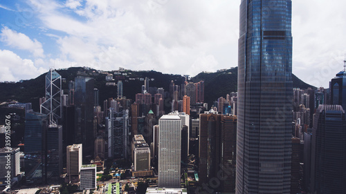 Aerial photo from flying drone of a International Finance Centre in China city with modern buildings. View on a exterior of Four Seasons Hotel Hong Kong. Metropolitan city with skyscrapers photo