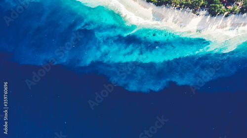 Top view aerial drone photo of unspoiled, deserted, powder-white sandy seashore with crystalline water. One of the most beautiful beaches in the world for travel website or journey blog background © BullRun