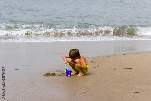 Summer' child Playing in the Sand