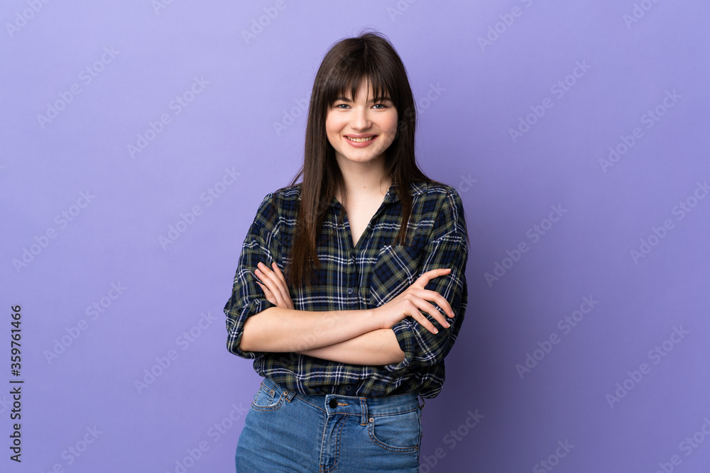 Young Ukrainian woman isolated on purple background keeping the arms crossed in frontal position Young Ukrainian woman isolated on purple background keeping the arms crossed in frontal position