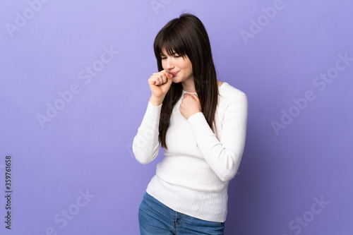 Young Ukrainian woman isolated on purple background coughing a lot