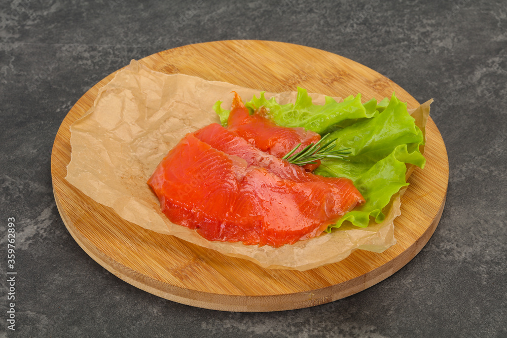 Sliced salmon fillet served rosemary Sliced salmon fillet served rosemary