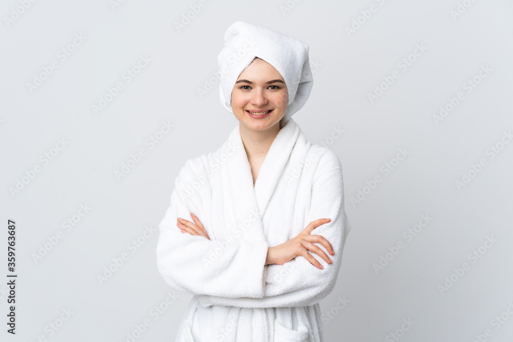 Teenager girl in a bathrobe isolated on white background smiling a lot Teenager girl in a bathrobe isolated on white background smiling a lot