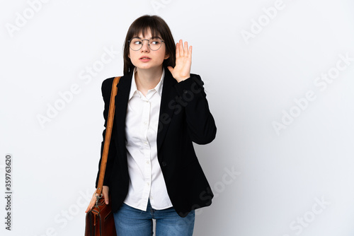 Ukranian business woman isolated on white background listening something
