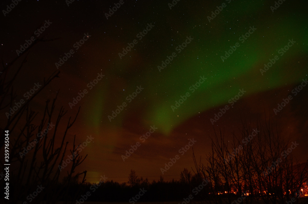 aurora borealis, northern light on a fire red sky in the arctic circle in the night, winter time aurora borealis, northern light on a fire red sky in the arctic circle in the night, winter time