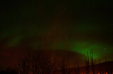 aurora borealis, northern light on a fire red sky in the arctic circle in the night, winter time