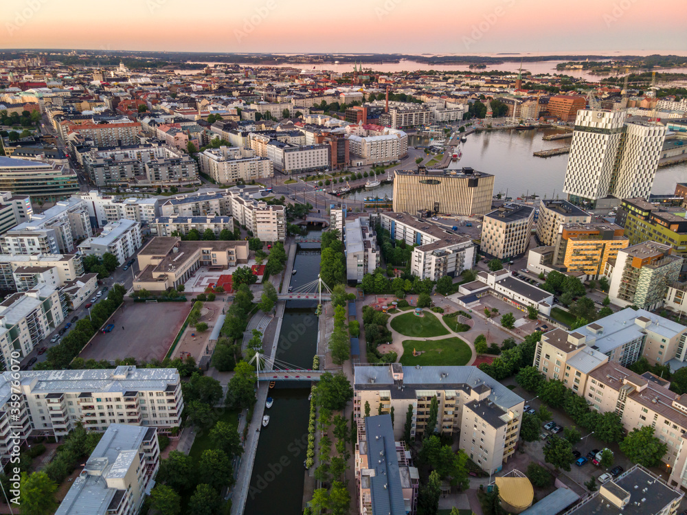 Aerial sunset view of beautiful city Helsinki . Colorful sky and colorful buildings. Helsinki, Finland.	