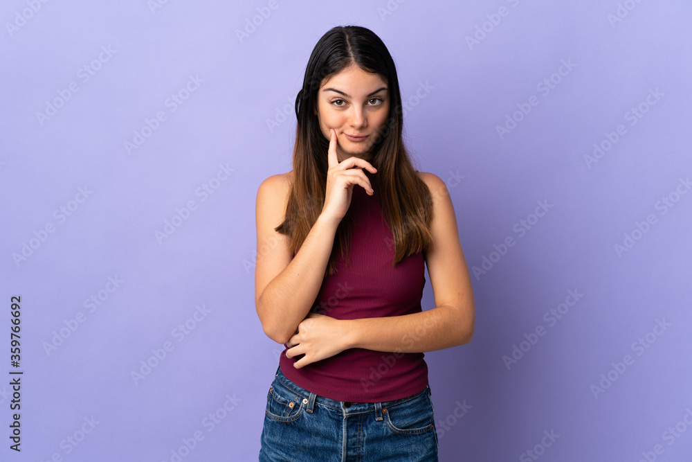 Young caucasian woman isolated on purple background and thinking Young caucasian woman isolated on purple background and thinking