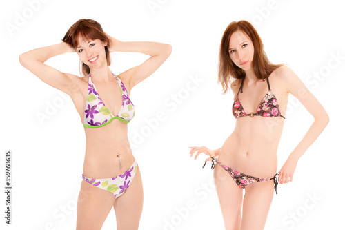 Portraits of two beautiful young women wearing colorful bikinis, isolated on white studio background