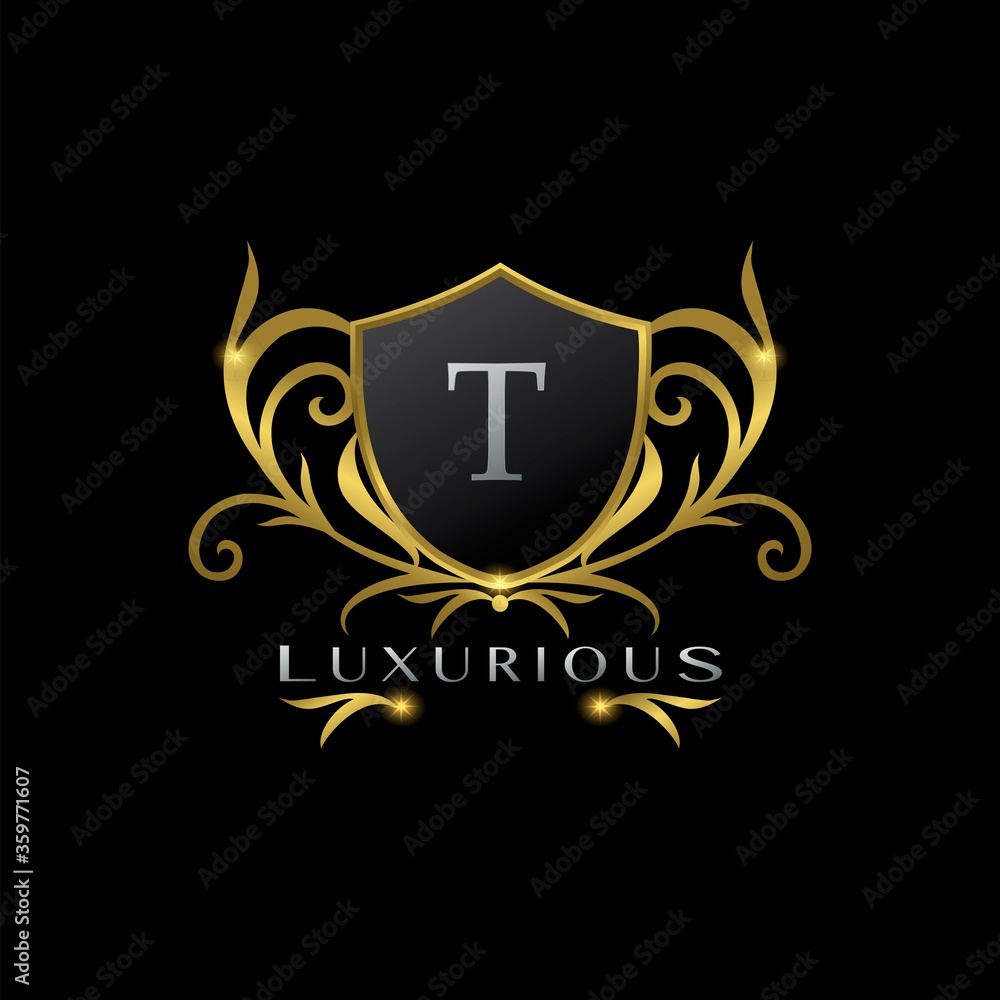 Obraz premium Golden Letter T Luxurious Shield Logo, vector design concept for luxuries business identity