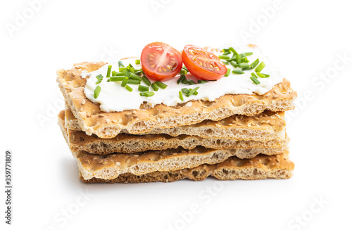Crispbread with creamy cheese, chive and cherry tomatoes