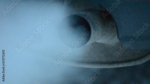idling car exhaust in winter
