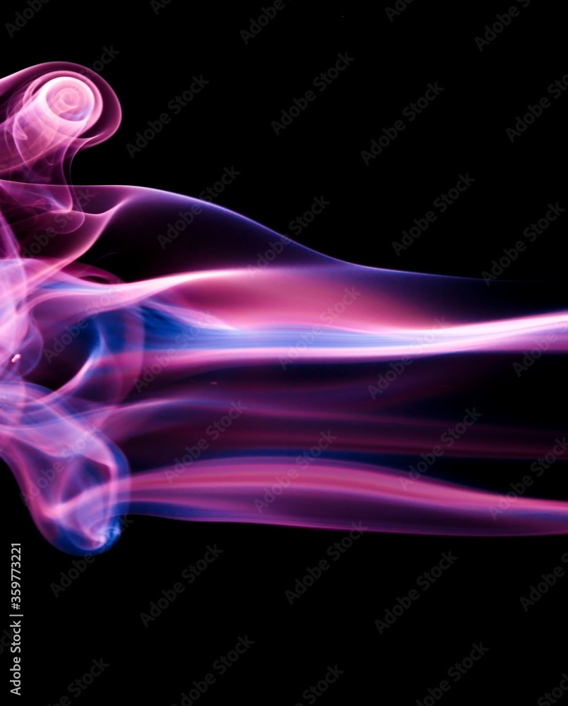 Naklejka premium Purple smoke on black background