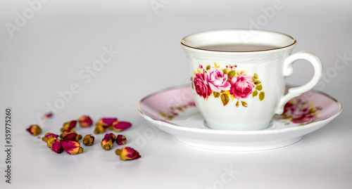 a cup of tea with dried roses