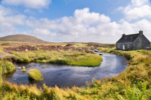 A cottage perched on the Isle of North Uist in the Outer Hebrides in Scotland