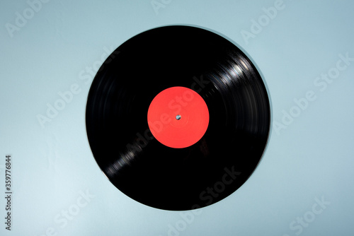 Black vinyl record with red label photo