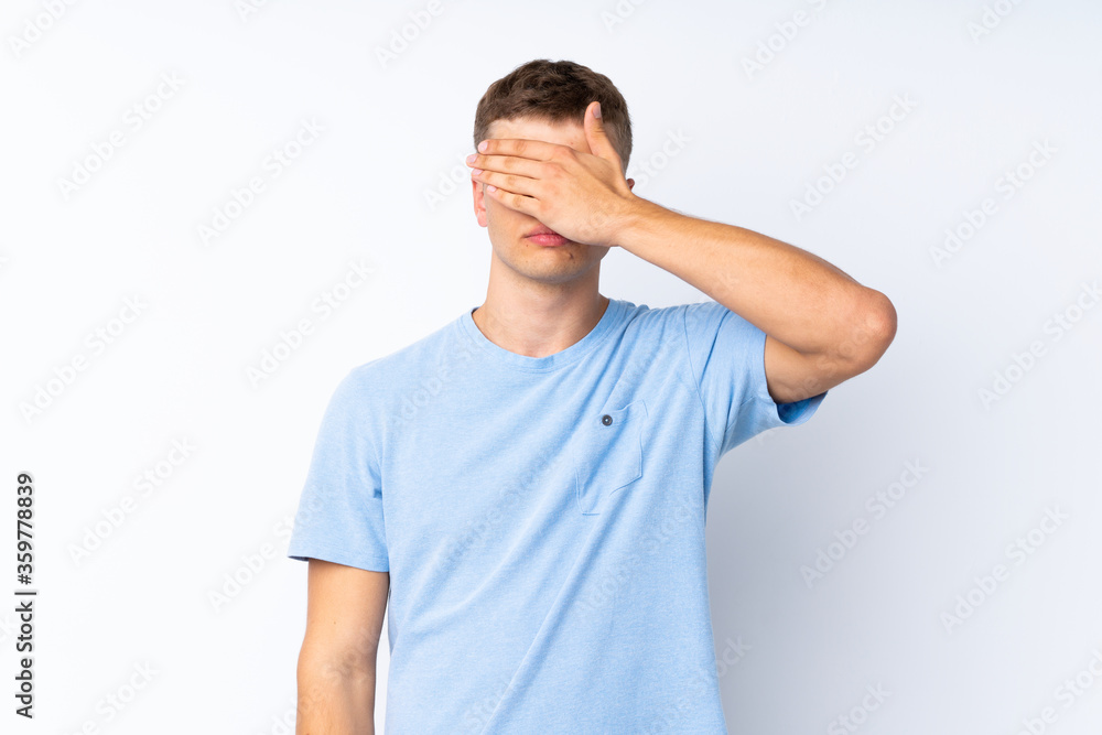 Young handsome man over isolated white background covering eyes by hands. Do not want to see something Young handsome man over isolated white background covering eyes by hands. Do not want to see something