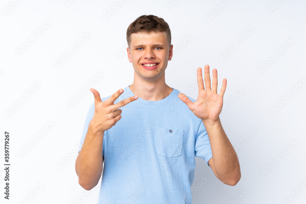 Young handsome man over isolated white background counting eight with fingers Young handsome man over isolated white background counting eight with fingers