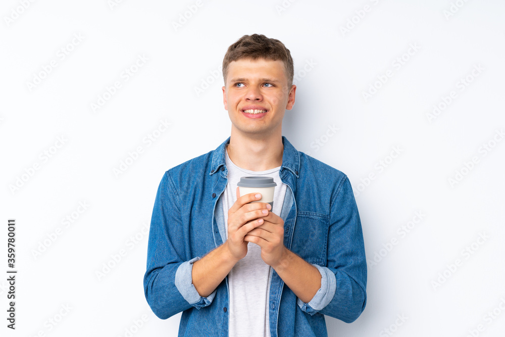 Young handsome man over isolated white background holding coffee to take away Young handsome man over isolated white background holding coffee to take away