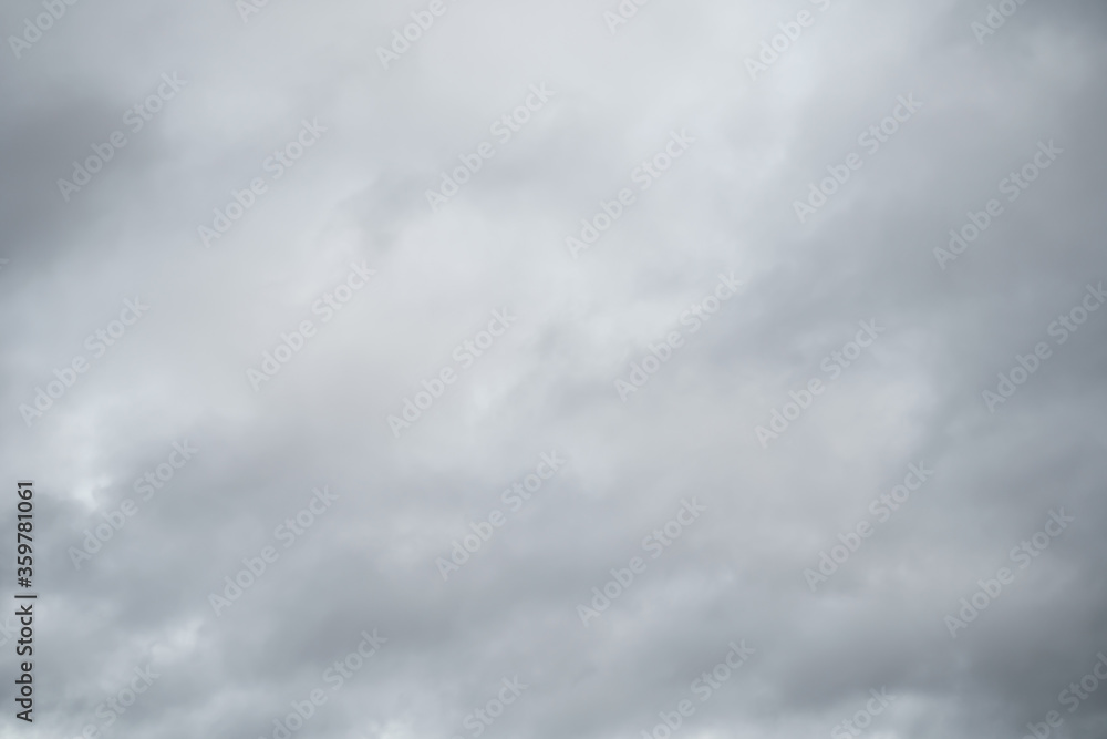 Grey sky with white clouds in rainy season. Beautiful grey and white sky background textures.