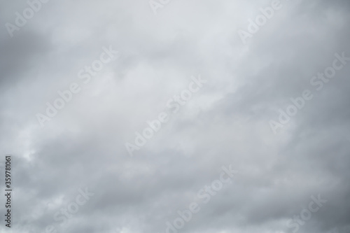 Grey sky with white clouds in rainy season. Beautiful grey and white sky background textures.