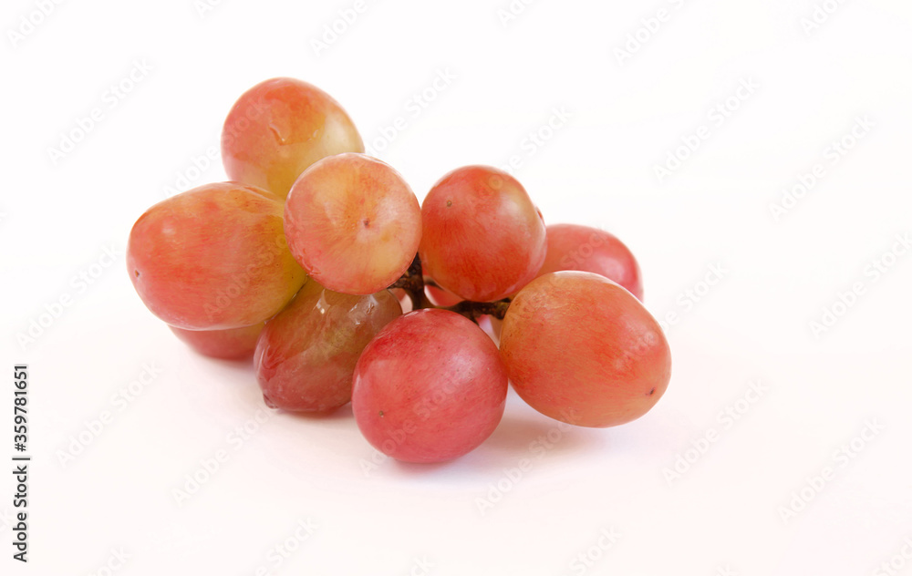 pink grape of grapes on a white background, close-up