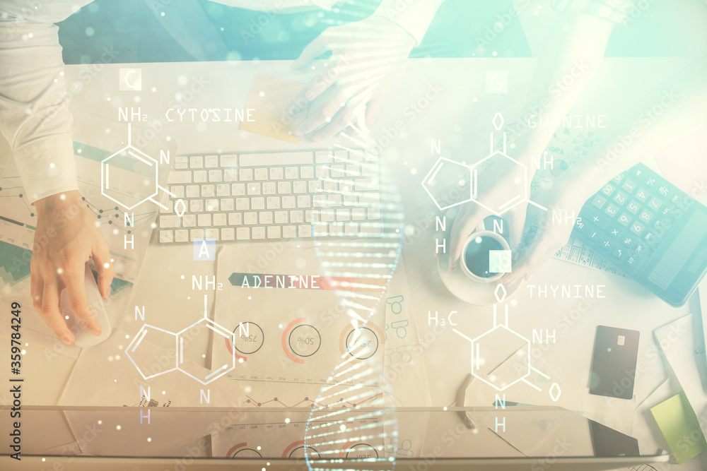 Double exposure of man and woman working together and DNA hologram drawing. Computer background. Medical education concept. Top View. Double exposure of man and woman working together and DNA hologram drawing. Computer background. Medical education concept. Top View.