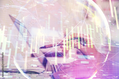 Multi exposure of woman hands typing on computer and business theme hologram drawing. Success concept.