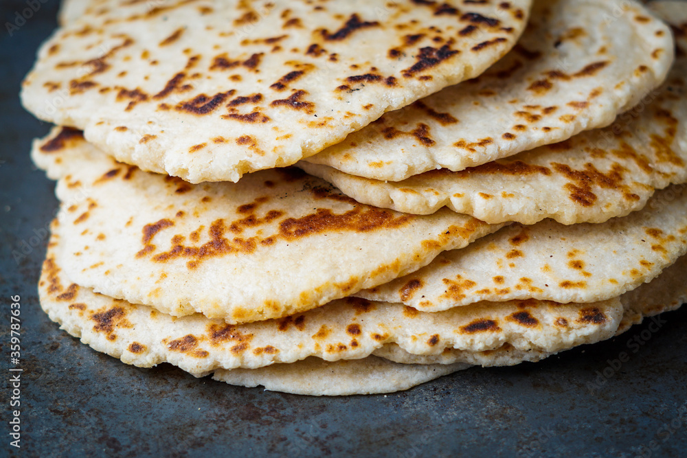 Stack of homemade naan bread