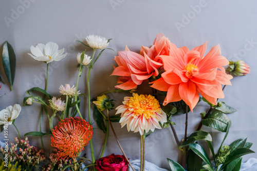 Nice floral background with garden flowers. Bouquet preparation. Copy space