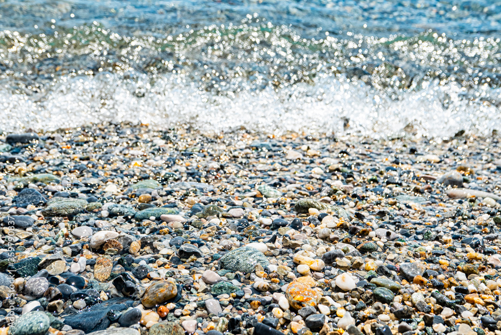 Pebbles in the water edge of a beach Pebbles in the water edge of a beach