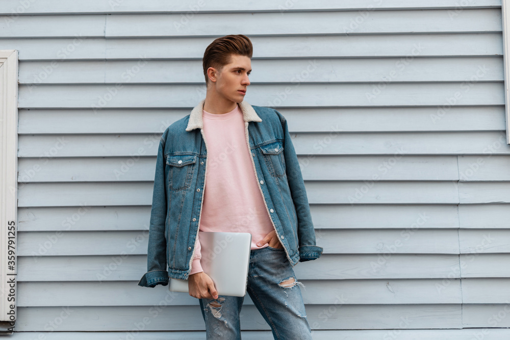 Free Photos - A Young, Good-looking Man Posing In Front Of A Bright Blue  Wall. He Is Wearing A Denim Jacket And Appears To Be The Main Subject Of  The Photo. There