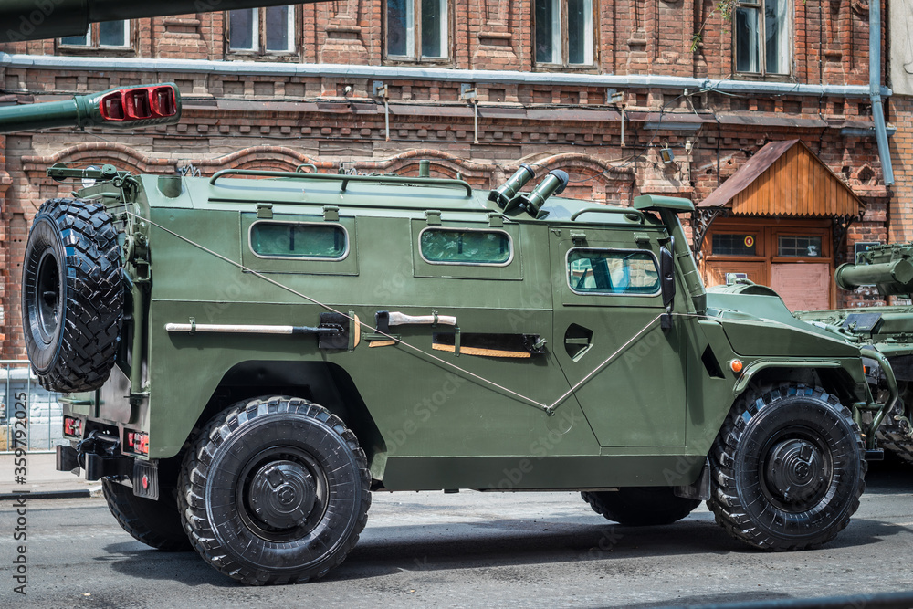 Army military armored car Tiger on the city street