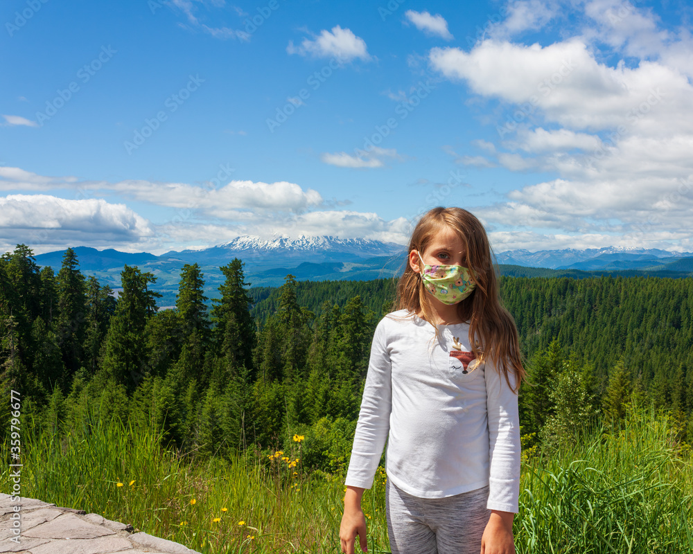 Young girl with mask mountain view
