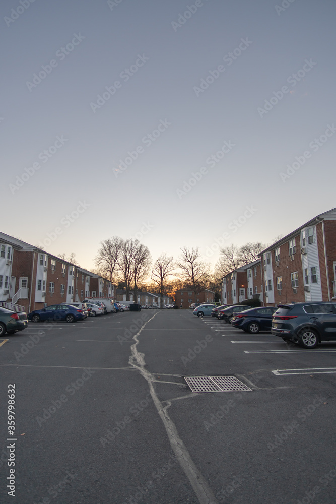 East Brunswick, New Jersey - January 6, 2019: Cars line up the parking lot of the Wyndmoor Apartment complex located in the suburbs of central New Jersey.