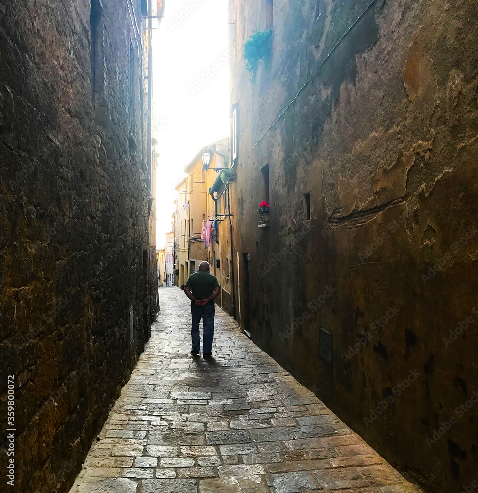 Old man in alleyway, Italy