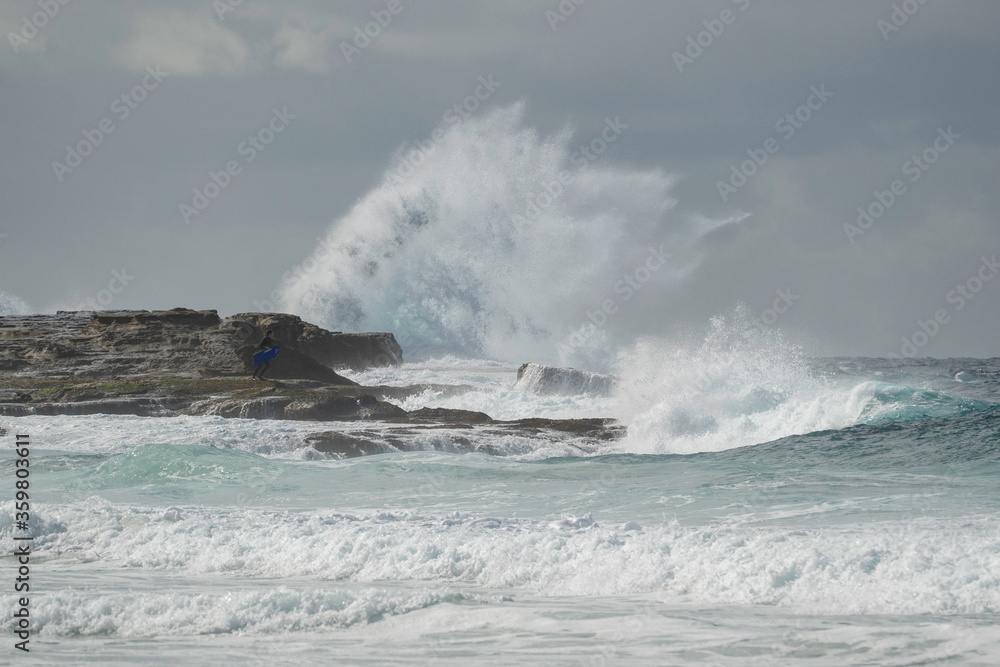Huge waves smashing against the cliffs at Maroubra Beach/ waves crashing on rocks
