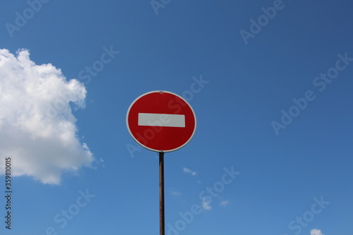 road sign travel is prohibited against the background of blue sky