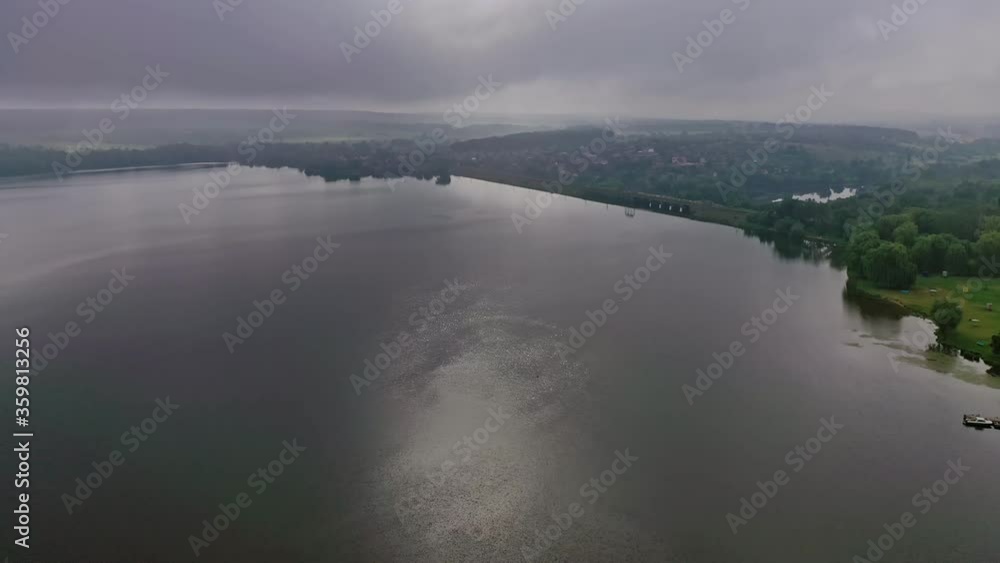 River at sunset. Beautiful view of a huge river in nature landscape. Shining of water at the evening sun. Aerial view. River at sunset. Beautiful view of a huge river in nature landscape. Shining of water at the evening sun. Aerial view.
