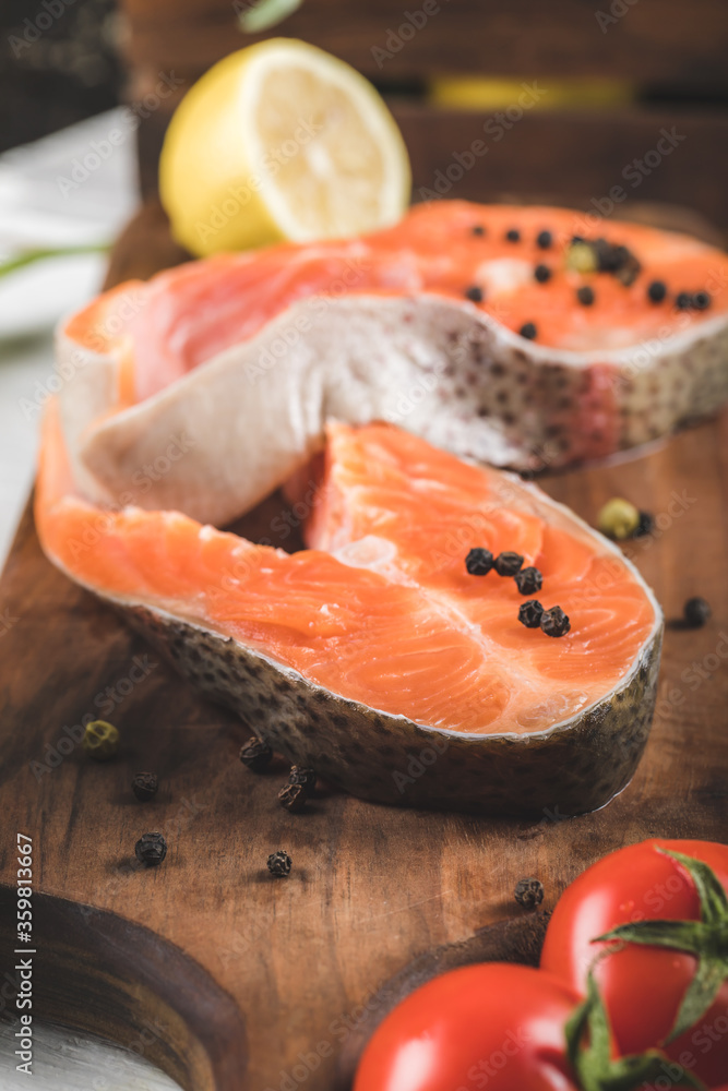 Salmon slices with lemon, tomatoes and pepper Salmon slices with lemon, tomatoes and pepper