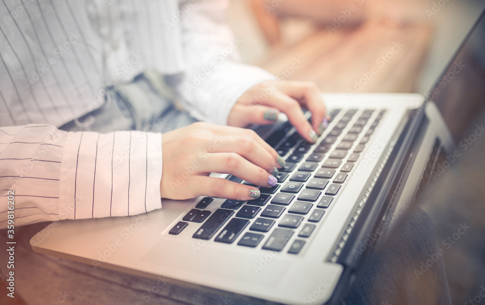 Closeup Business Woman hand on laptop keyboard at outdoor work. Closeup Business Woman hand on laptop keyboard at outdoor work.