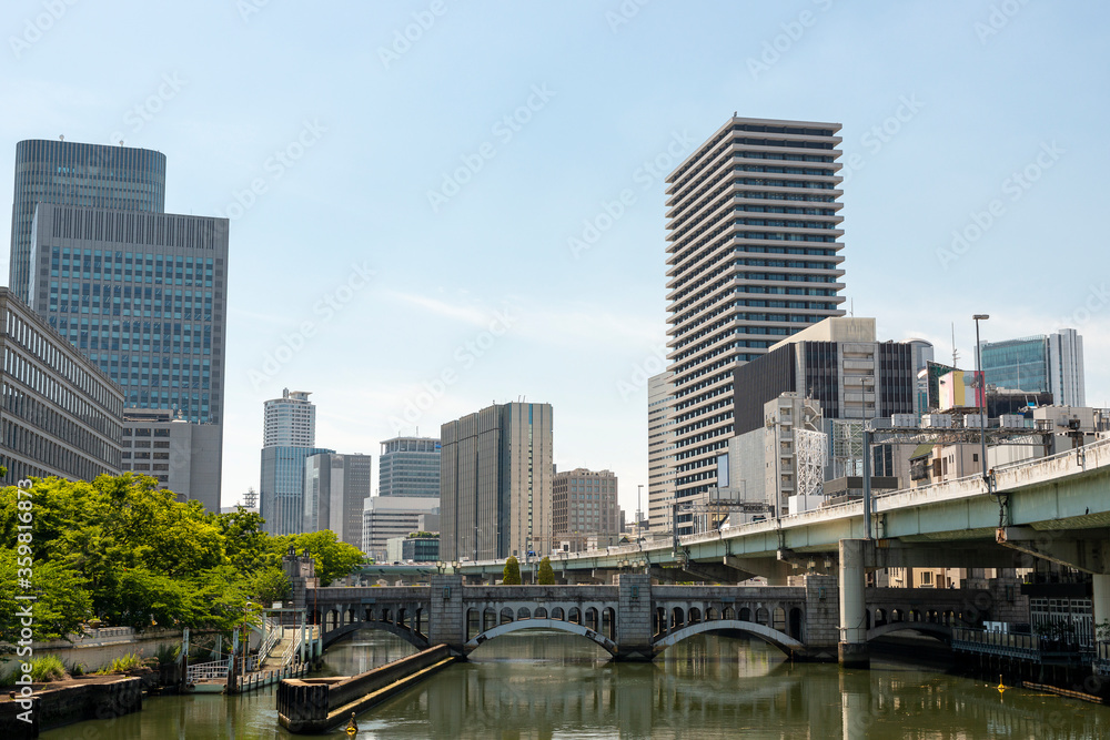 Suisho bridge over Dojima river and office buildings in Osaka, Japan