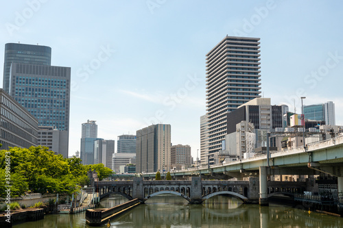 Suisho bridge over Dojima river and office buildings in Osaka  Japan