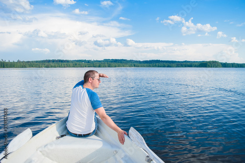 Man sitting on the boat. © alurk