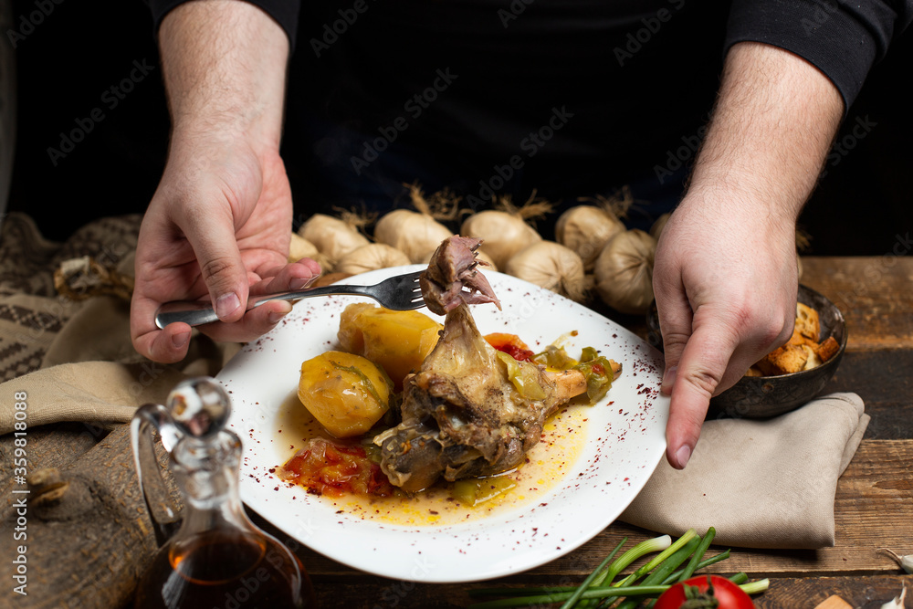 delicious meat meal with tomato on dark background