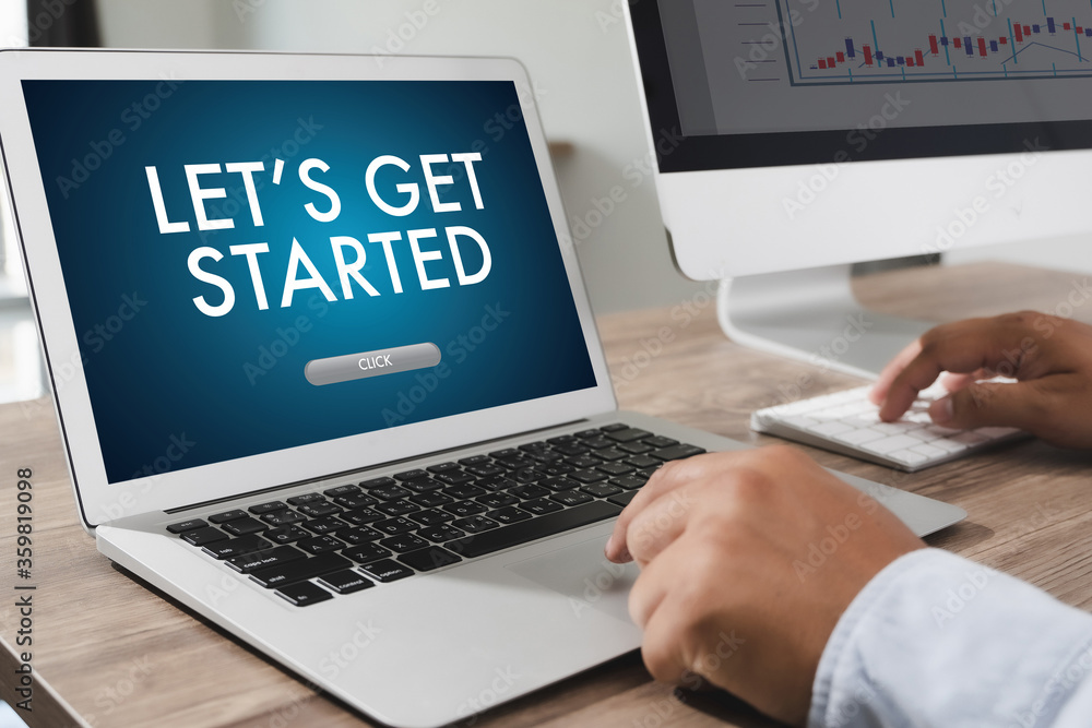 LET'S GET STARTED Thoughtful male person looking to the digital tablet screen, laptop screen LET'S GET STARTED Thoughtful male person looking to the digital tablet screen, laptop screen