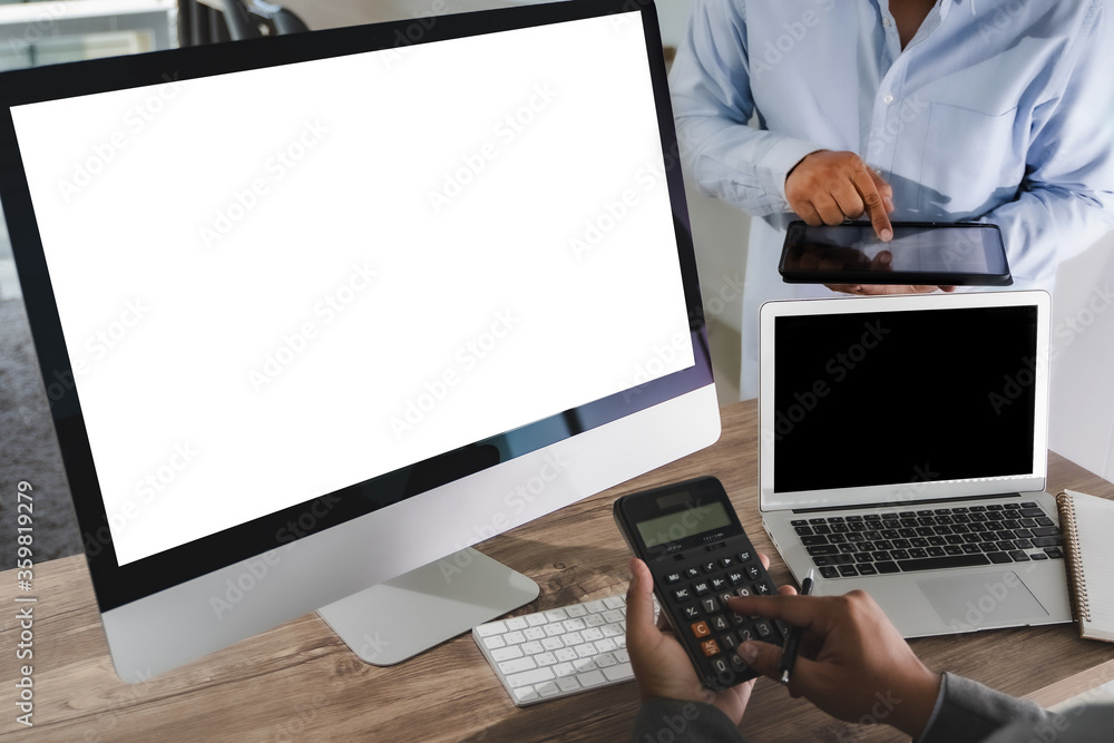 Man of business man hand working on laptop computer on wooden desk Laptop with blank screen on table. Man of business man hand working on laptop computer on wooden desk Laptop with blank screen on table.